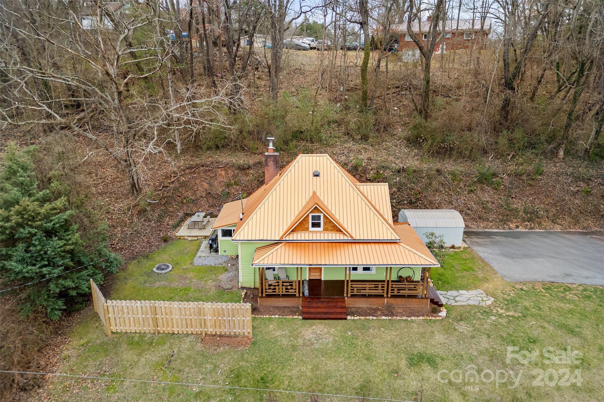 24 Brookside Street Clyde, NC 28721 - Photo 2 of 40 a view of a house with a yard