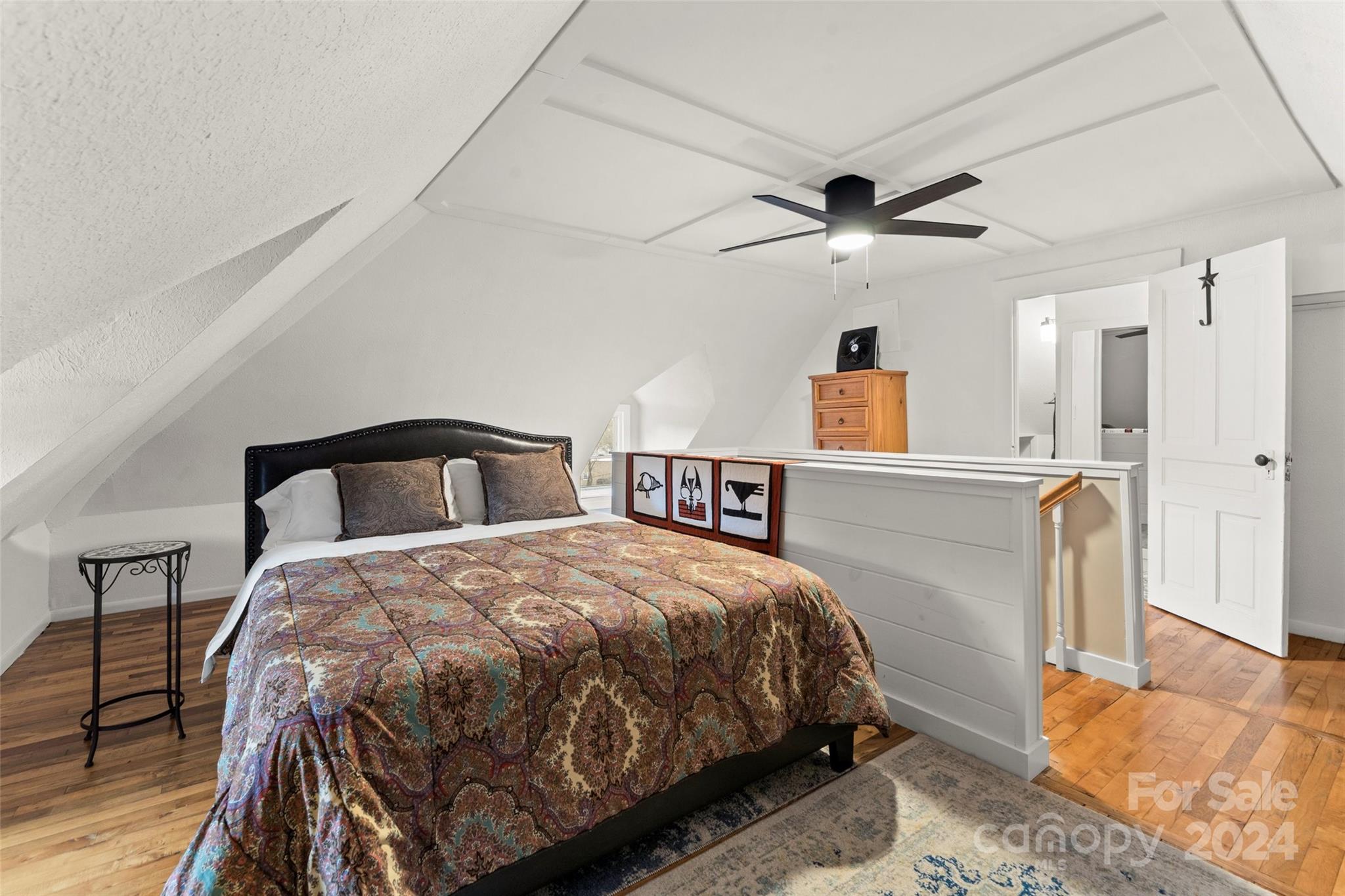 24 Brookside Street Clyde, NC 28721 - Photo 23 of 40 a bedroom with a bed and a table with closet
