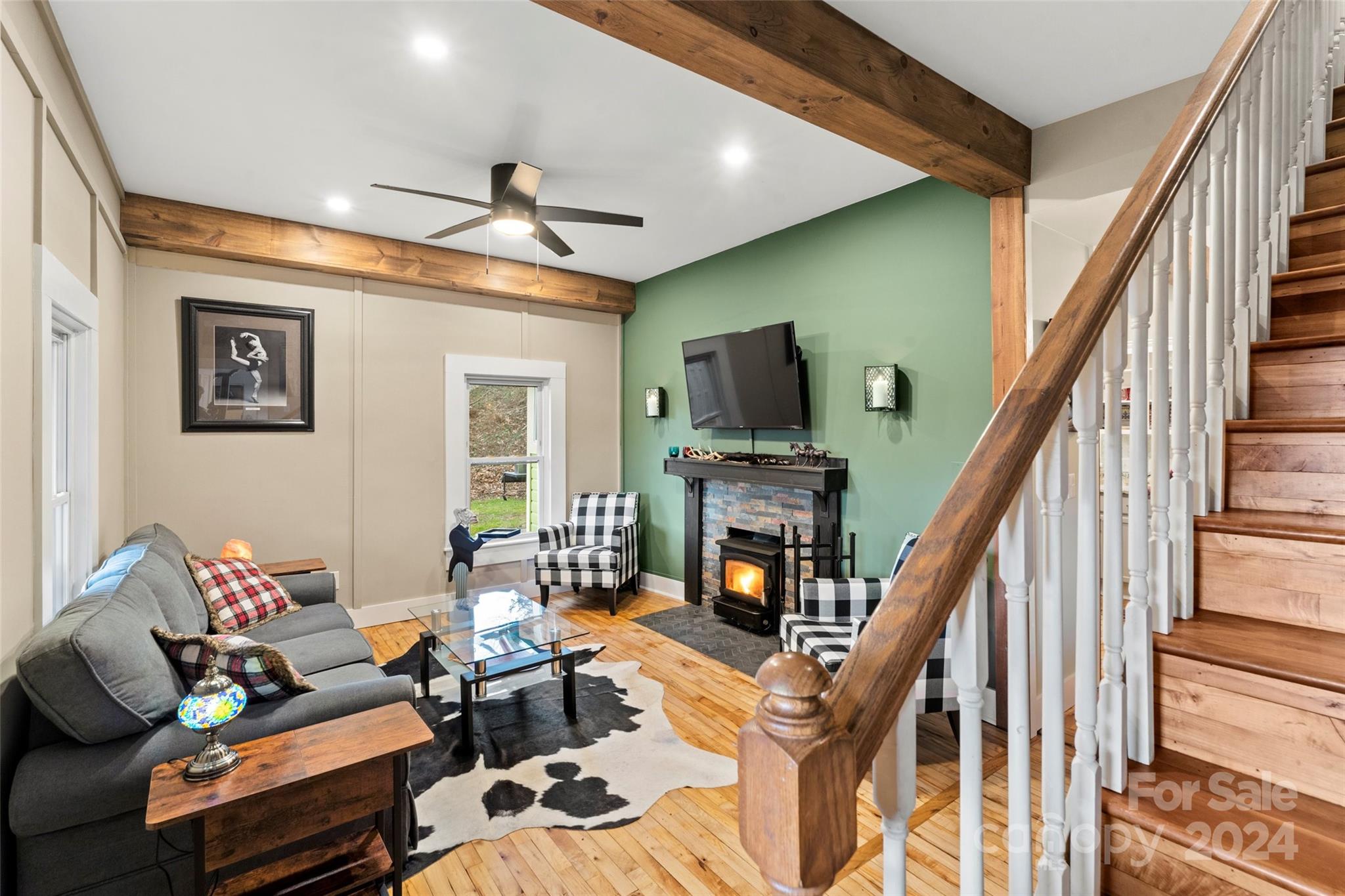 24 Brookside Street Clyde, NC 28721 - Photo 5 of 40 a living room with furniture and a fireplace