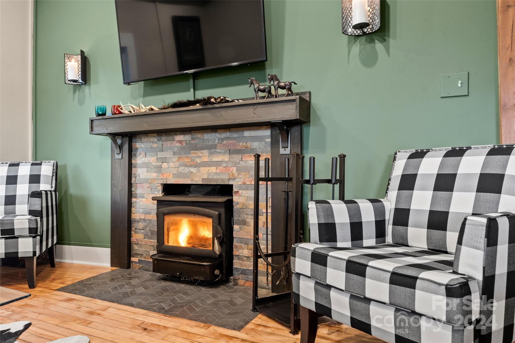 24 Brookside Street Clyde, NC 28721 - Photo 7 of 40 a living room with furniture and a fireplace