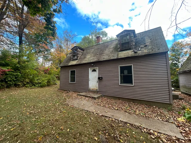 a house view with a backyard space
