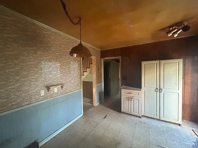 a kitchen with stainless steel appliances a refrigerator and a stove