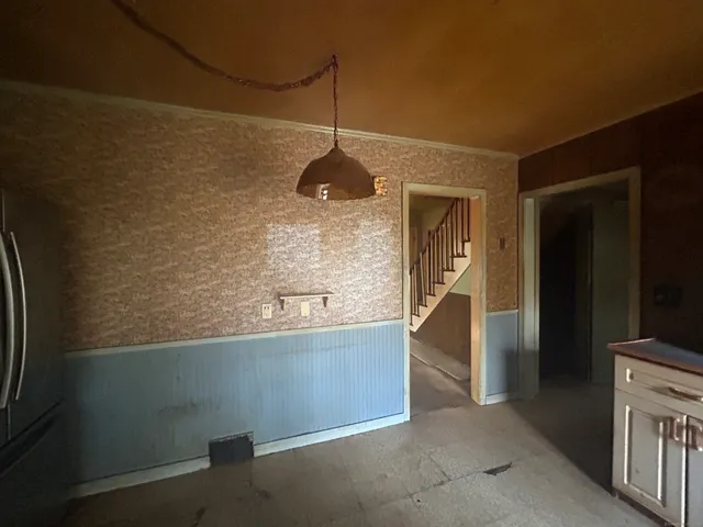 a kitchen with kitchen island a counter top space and cabinets