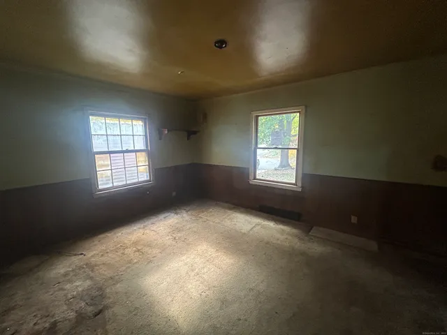 an empty room with windows