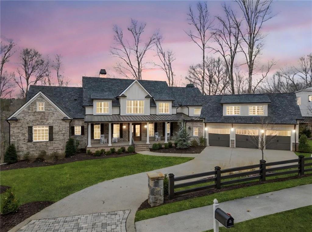 310 Timberview Trail Alpharetta, GA 30004 - Photo 1 of 71 a front view of a house with a garden and trees