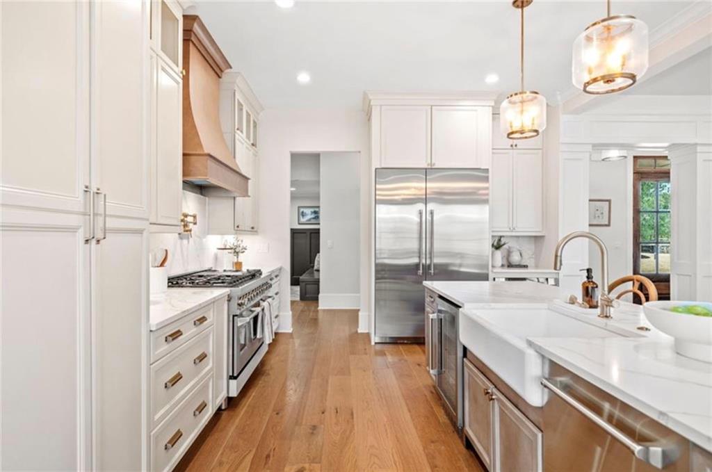 310 Timberview Trail Alpharetta, GA 30004 - Photo 15 of 71 a kitchen with stainless steel appliances a sink stove and refrigerator
