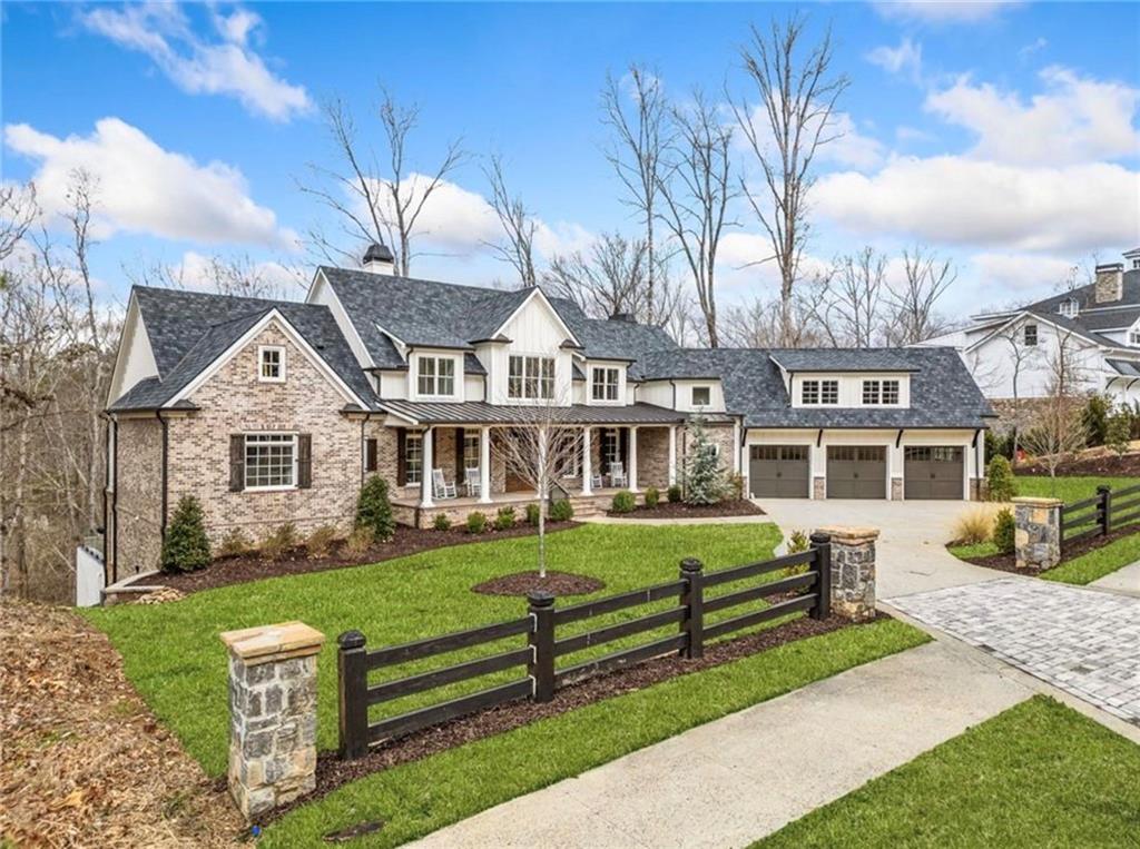 310 Timberview Trail Alpharetta, GA 30004 - Photo 3 of 71 a front view of a house with a garden and trees
