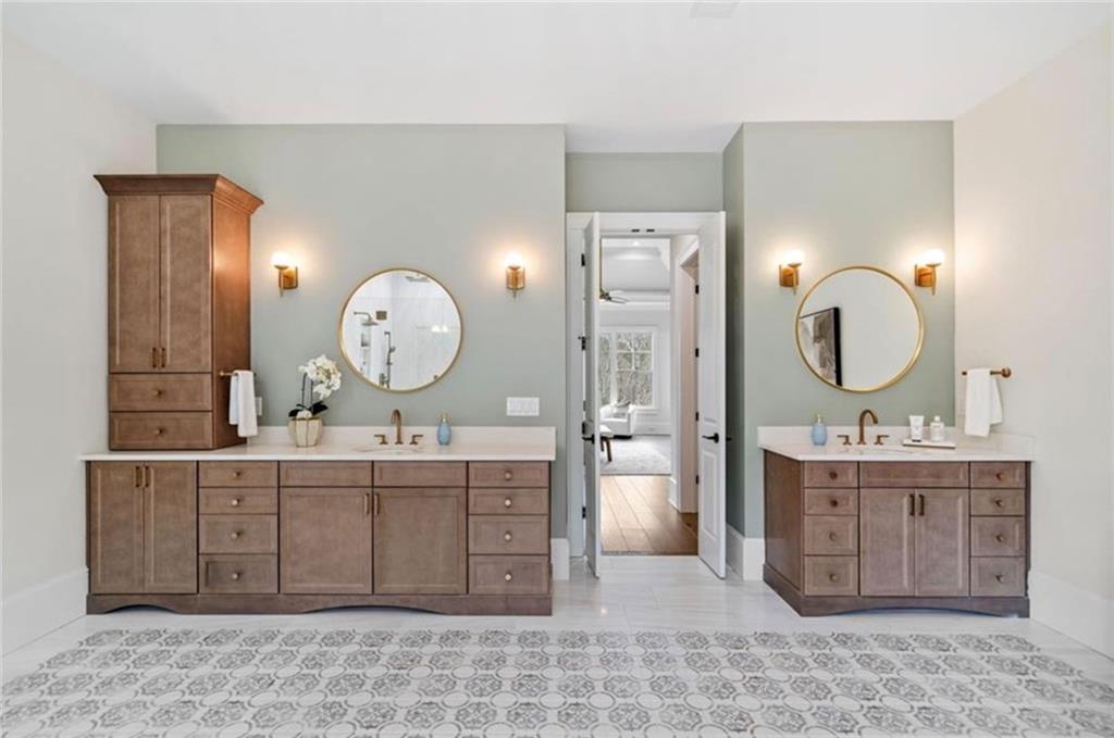 310 Timberview Trail Alpharetta, GA 30004 - Photo 32 of 71 a room with a cabinets a sink and a mirror