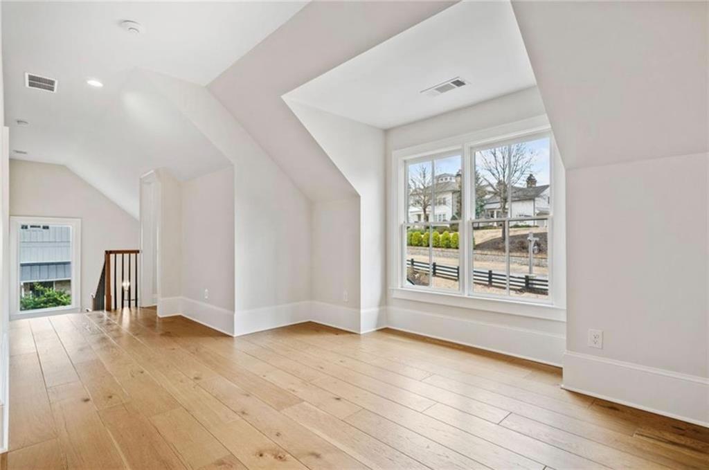 310 Timberview Trail Alpharetta, GA 30004 - Photo 34 of 71 a view of a big room with wooden floor and windows