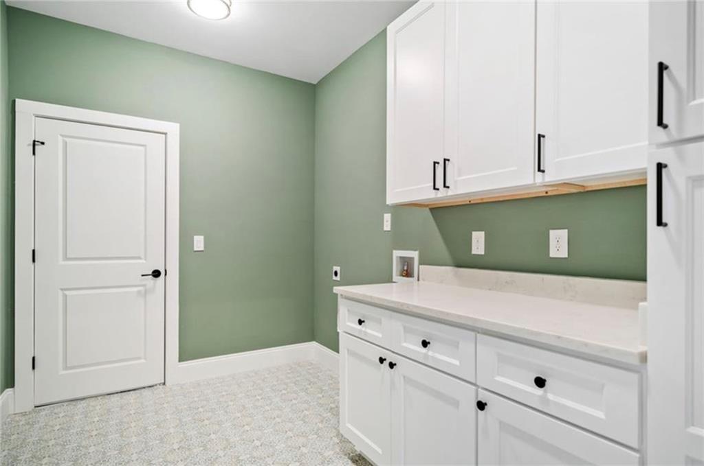 310 Timberview Trail Alpharetta, GA 30004 - Photo 38 of 71 a kitchen with a cabinets and a sink