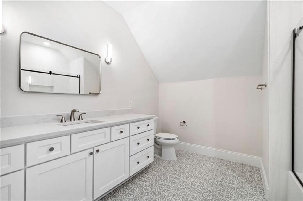 310 Timberview Trail Alpharetta, GA 30004 - Photo 42 of 71 a bathroom with a toilet a sink and mirror