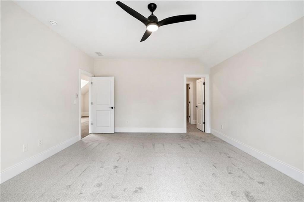 310 Timberview Trail Alpharetta, GA 30004 - Photo 45 of 71 an empty room with a ceiling fan and window
