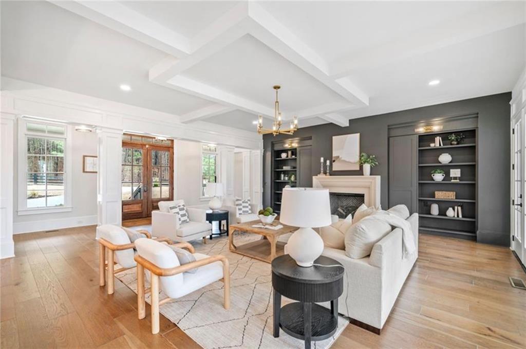 310 Timberview Trail Alpharetta, GA 30004 - Photo 8 of 71 a living room with fireplace furniture and a wooden floor