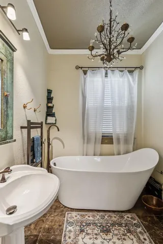 a bathroom with a bathtub and sink