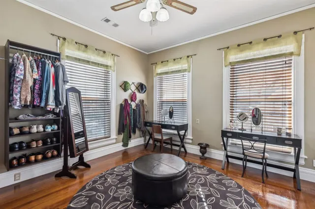 a room with furniture a rug and a window