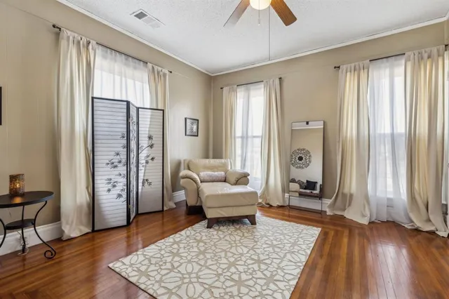 a living room with furniture and a rug