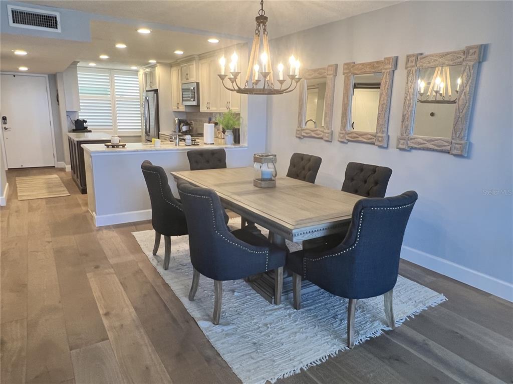 7100 Sunset Way, Unit PH5 St. Pete Beach, FL 33706 - Photo 13 of 32 a view of a dining room with furniture