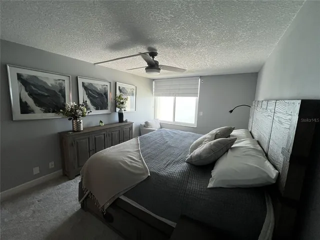 a bathroom with a double vanity sink toilet and mirror