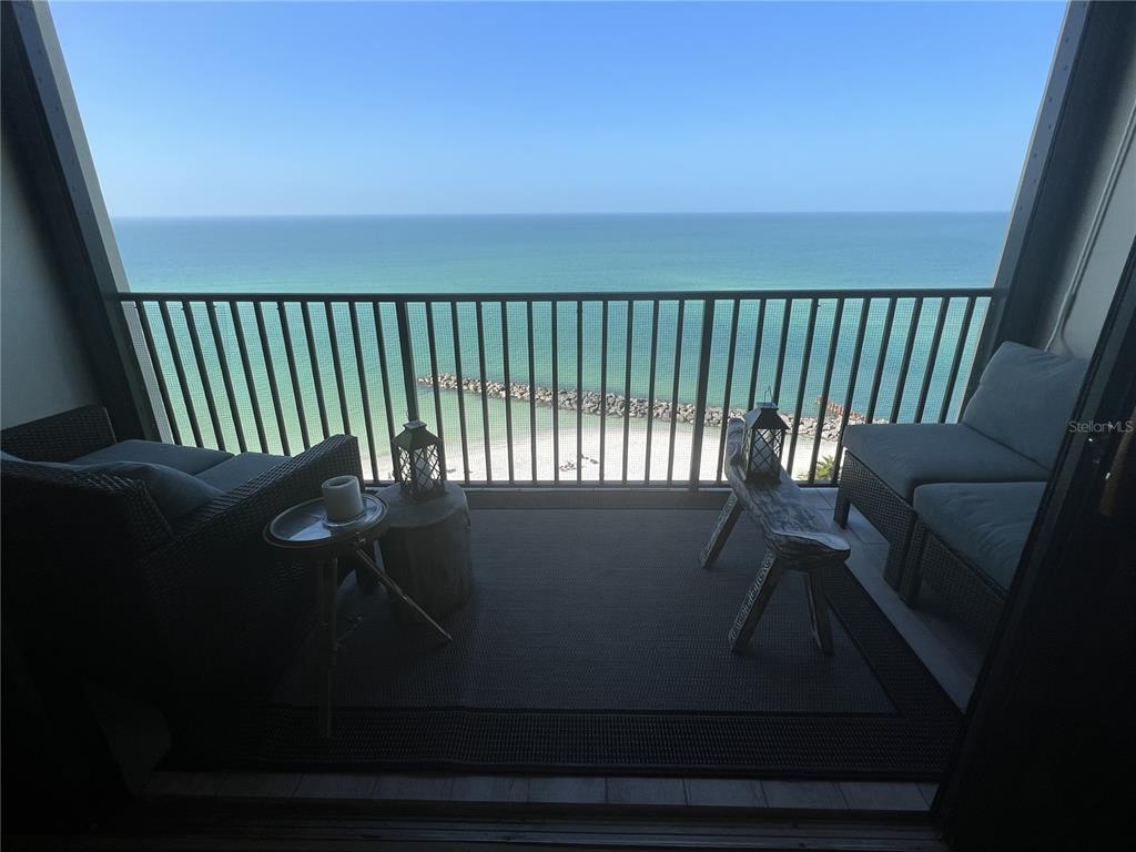 7100 Sunset Way, Unit PH5 St. Pete Beach, FL 33706 - Photo 21 of 32 a view of balcony with furniture