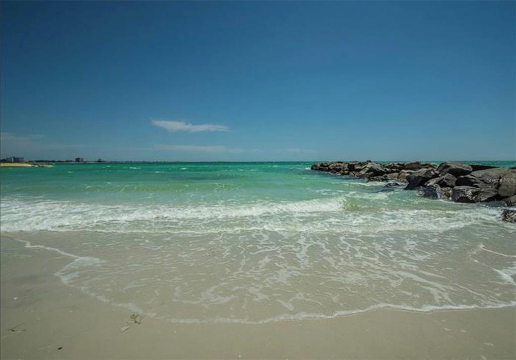 7100 Sunset Way, Unit PH5 St. Pete Beach, FL 33706 - Photo 25 of 32 a view of a room with a wooden floor