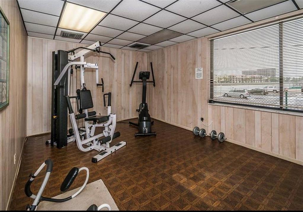 7100 Sunset Way, Unit PH5 St. Pete Beach, FL 33706 - Photo 29 of 32 a view of a room with gym equipment