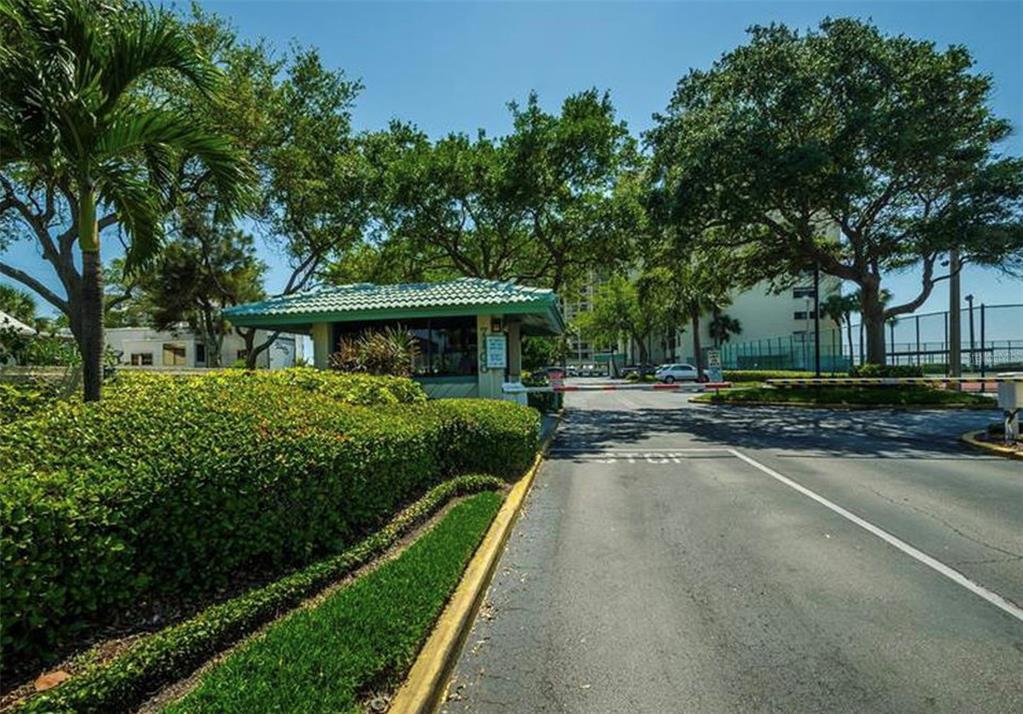 7100 Sunset Way, Unit PH5 St. Pete Beach, FL 33706 - Photo 31 of 32 a front view of a house with yard