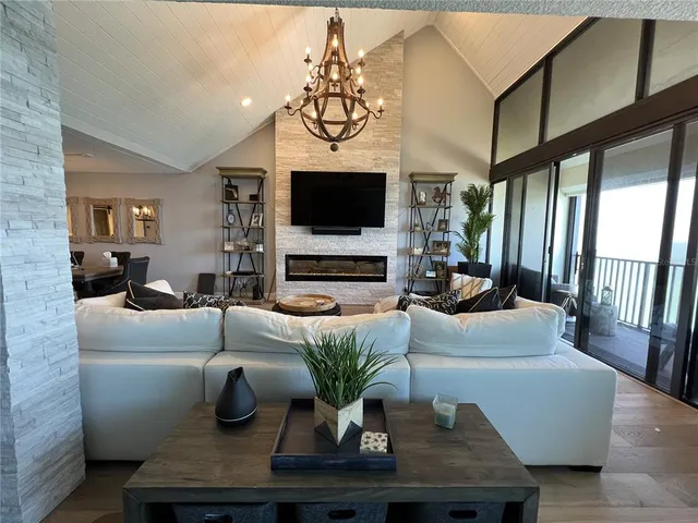 a kitchen with a refrigerator a sink dishwasher and a stove with wooden floor