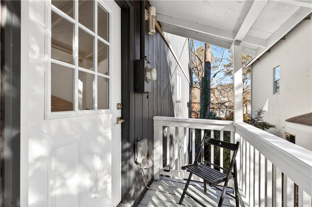 Undisclosed Address Brookhaven, GA 30319 - Photo 26 of 63 a view of balcony with wooden floor and fence