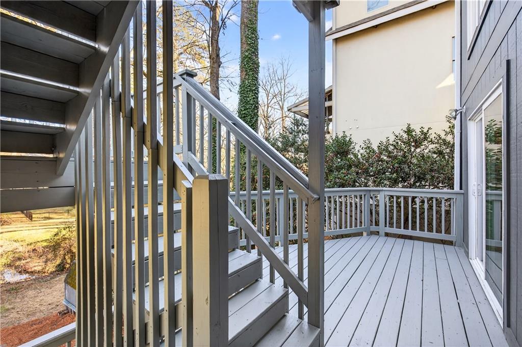 Undisclosed Address Brookhaven, GA 30319 - Photo 31 of 63 a view of balcony with wooden floor and fence