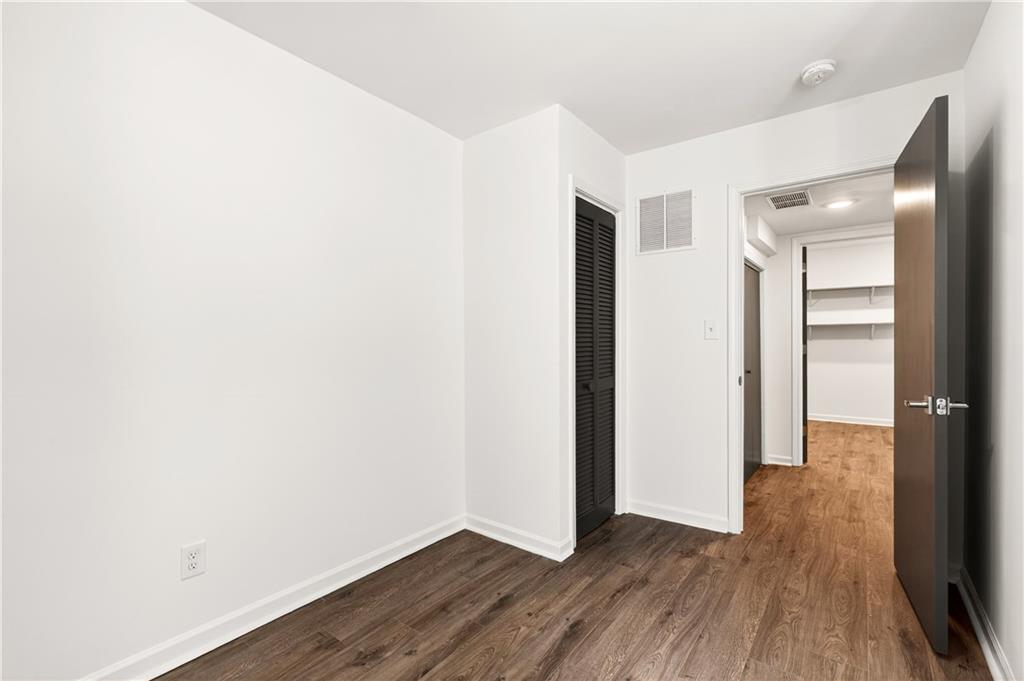 Undisclosed Address Brookhaven, GA 30319 - Photo 47 of 63 a view of hallway with wooden floor