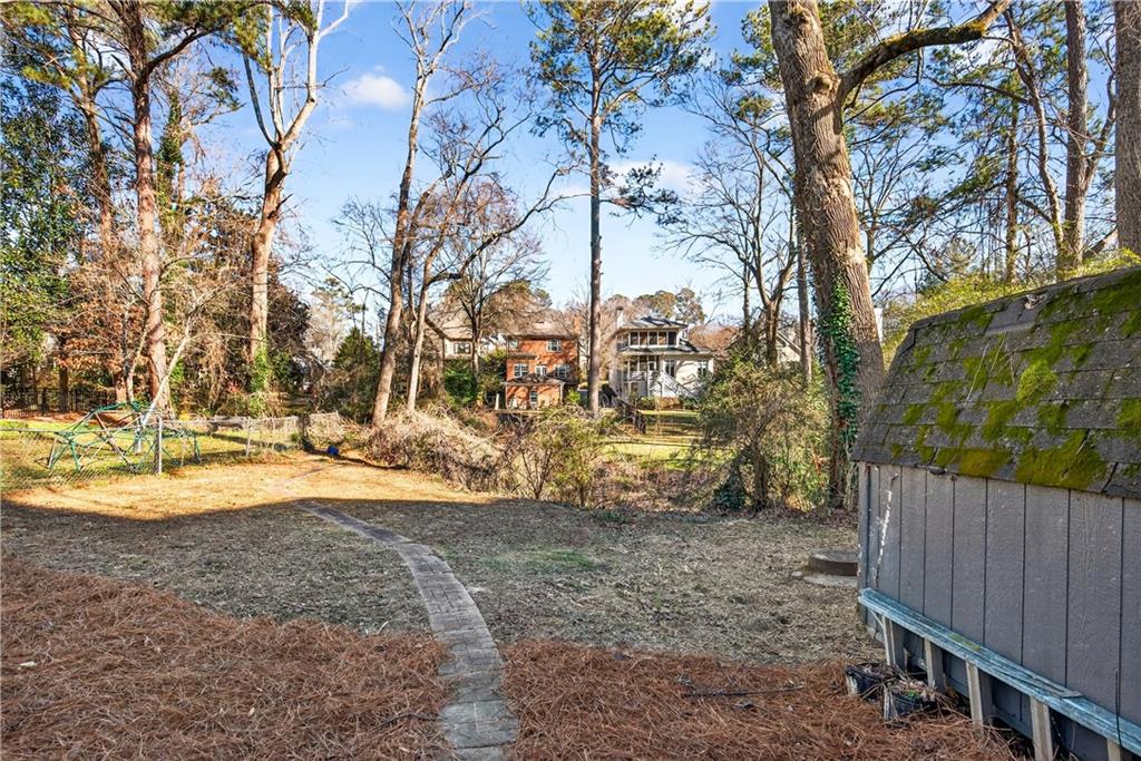 Undisclosed Address Brookhaven, GA 30319 - Photo 56 of 63 a view of a yard with a tree