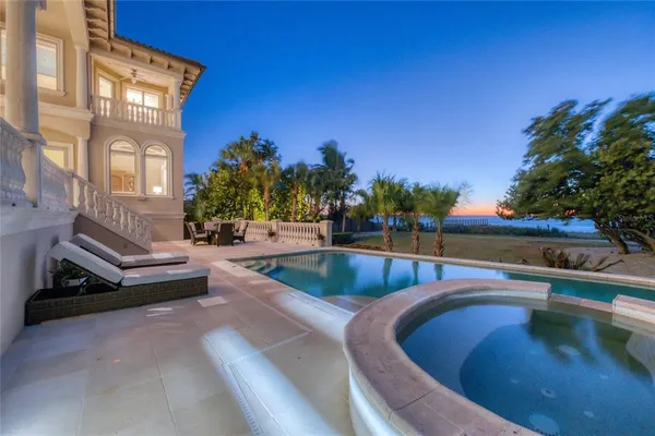 a view of a swimming pool with a patio