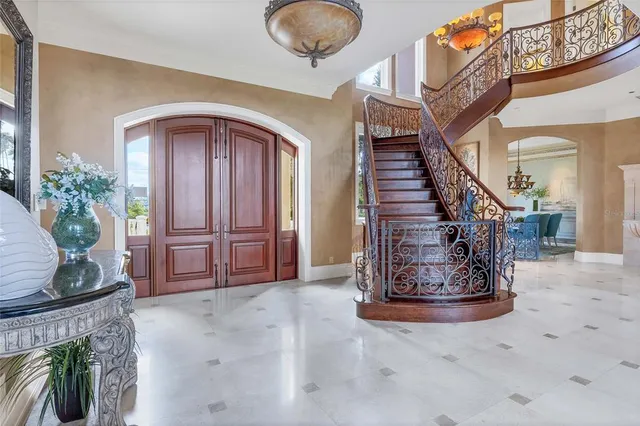 a view of entryway and hall with a front door