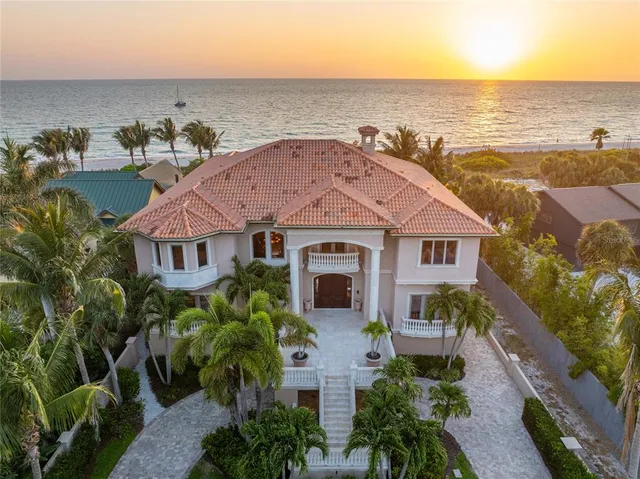 an aerial view of a house with a ocean view