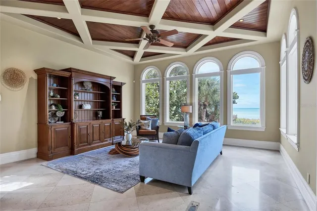 a dining room with furniture and chandelier