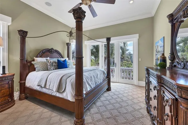 a living room with furniture a fireplace and a chandelier