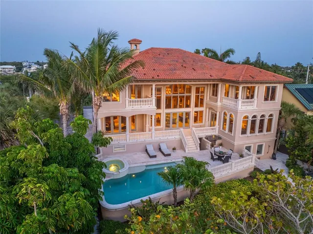 aerial view of a house with yard and sitting area