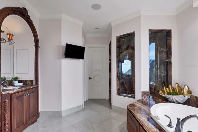 a spacious bathroom with a double vanity sink and mirror
