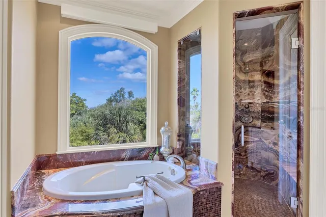 a spacious bedroom with a large bed and a window