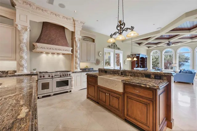 a kitchen with stainless steel appliances granite countertop a stove and a sink