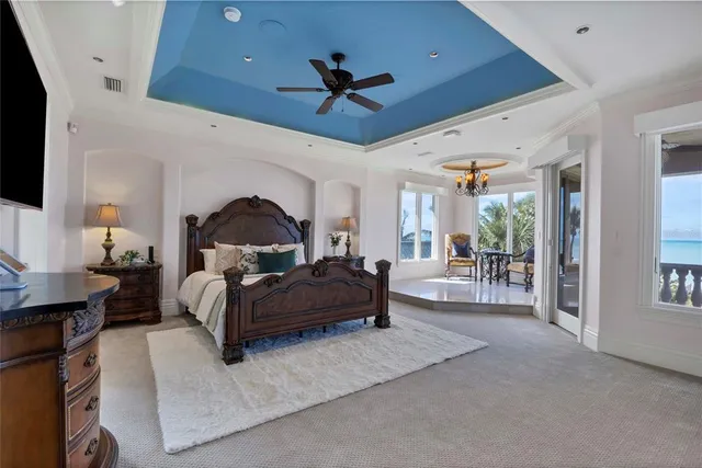 a living room with furniture ceiling fan and a rug