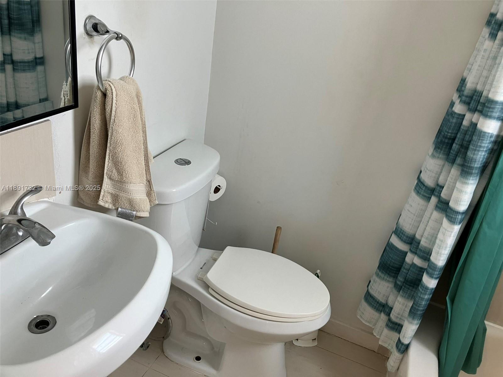 335 Ocean Drive, Unit 306 Miami Beach, FL 33139 - Photo 14 of 34 a bathroom with a sink and toilet