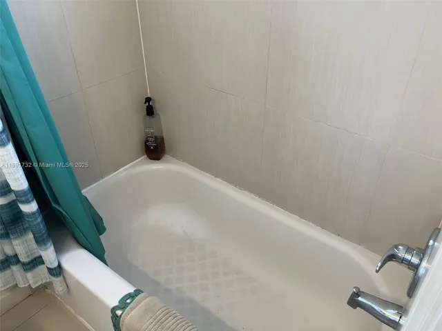 a bedroom with a bed and furniture