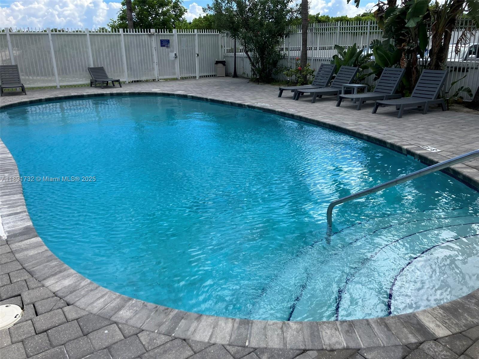 335 Ocean Drive, Unit 306 Miami Beach, FL 33139 - Photo 18 of 34 a view of a swimming pool with an outdoor space