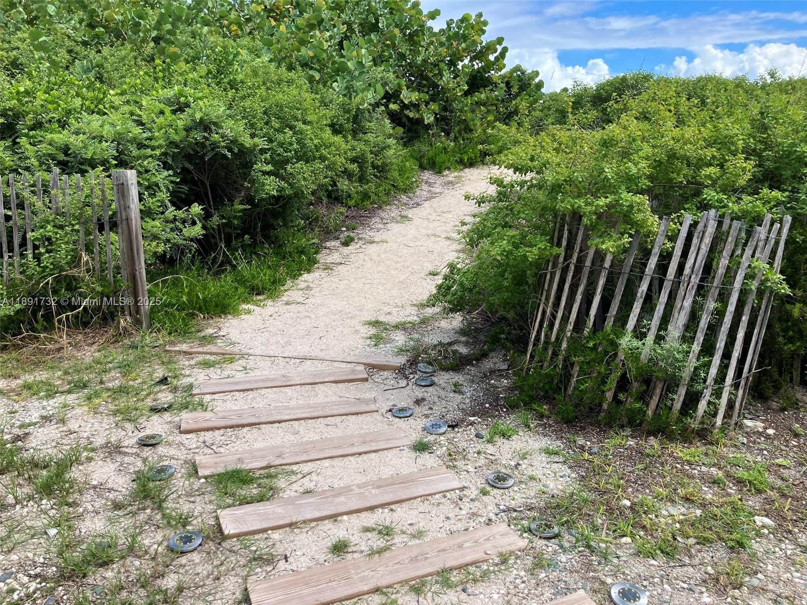 335 Ocean Drive, Unit 306 Miami Beach, FL 33139 - Photo 19 of 34 a view of garden with wooden fence