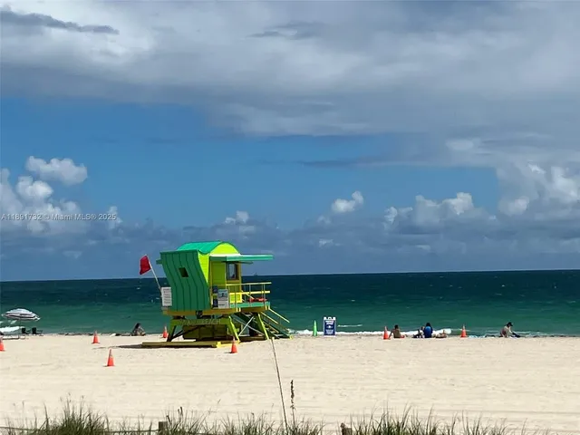 a view of a swimming pool with a yard