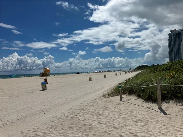 a view of swimming pool with outdoor seating and city view