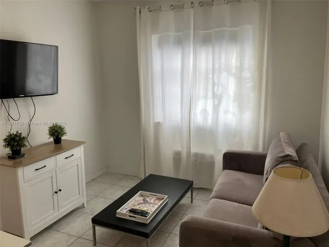 a view of a workspace with furniture