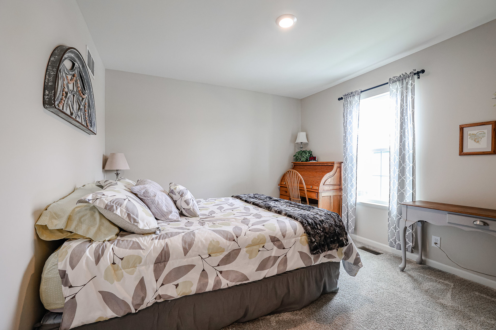 216 North Barry Road South Elgin, IL 60177 - Photo 23 of 50 a bedroom with a bed and a painting on the wall