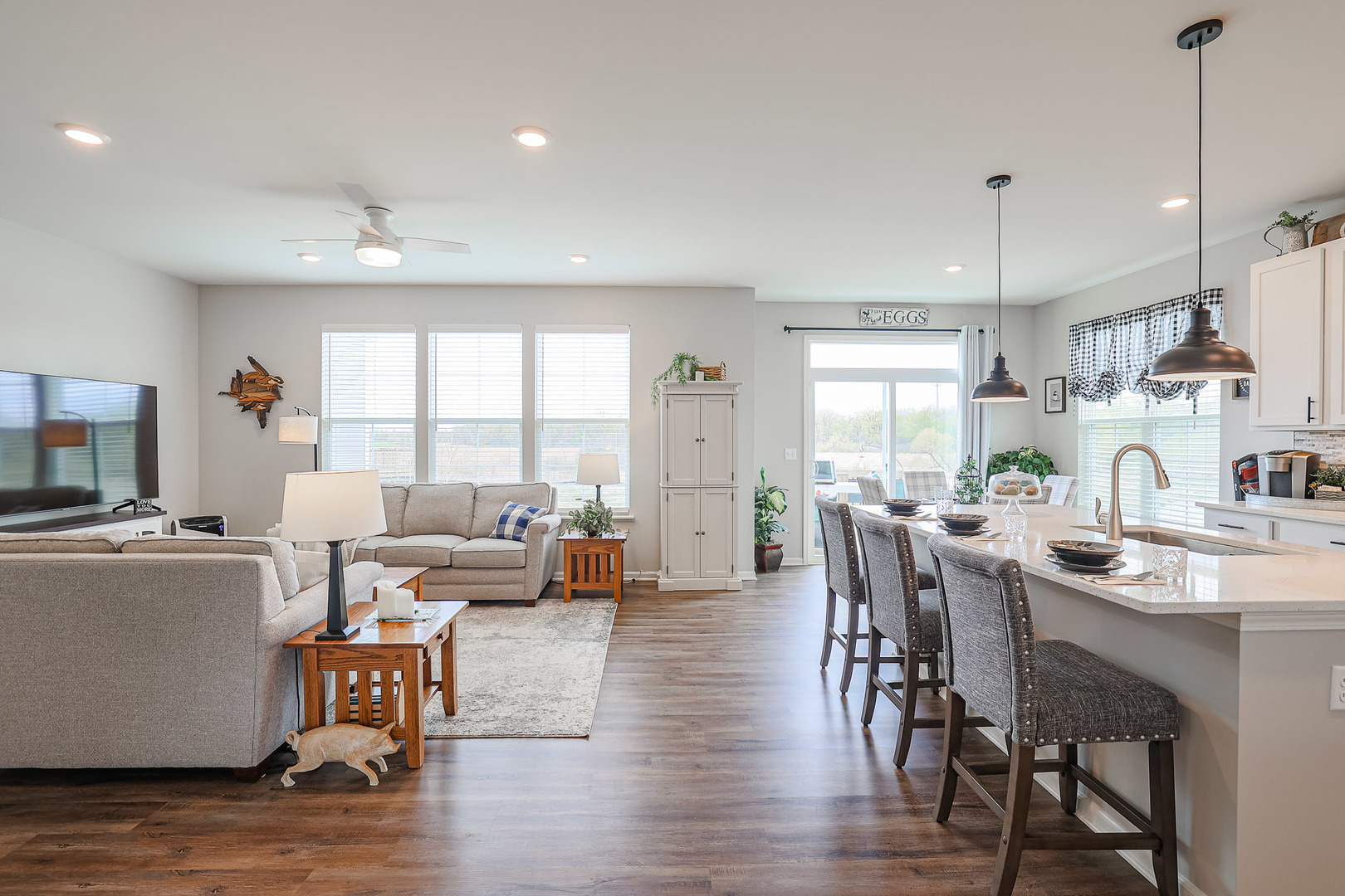 216 North Barry Road South Elgin, IL 60177 - Photo 6 of 50 a view of a dining room and livingroom with furniture wooden floor a chandelier